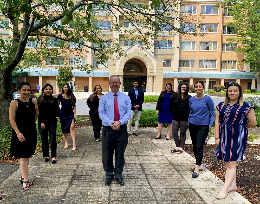 Professionaly dressed people working with documents and a book of law.